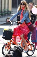 woman pedaling the Bigfish folding bike